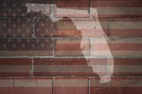Map of florida state on a painted flag of united states of america on a bri.. Stock Photos