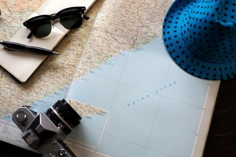 Map with fun hat and camera Фото