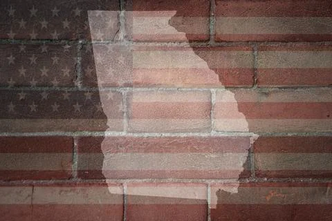 Map of georgia state on a painted flag of united states of america on a bri.. Stock Photos