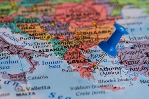 Map of Greece with a blue pushpin stuck Stock Photos