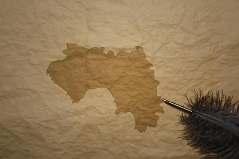 Map of guinea on a old paper background with old pen 스톡 사진