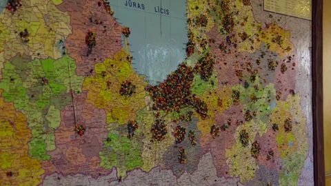 Map of Latvia Fixed to the Wall with Lots of Colorful Pins. Stock Footage 297495509
