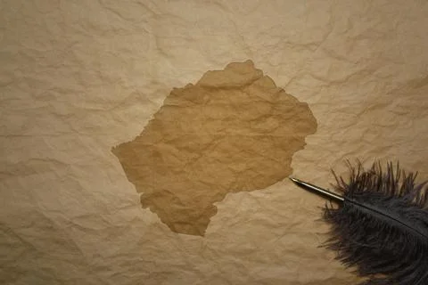 Map of lesotho on a old paper background with old pen Stock Photos
