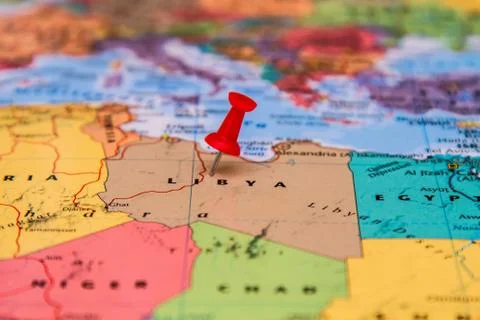 Map of Libya with a red pushpin stuck Stock Photos