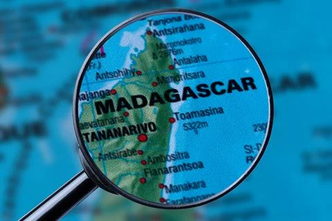 Map of MADAGASCAR through magnifying glass. Stock Photos