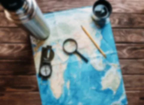 Map with a magnifying glass. Stock Photos