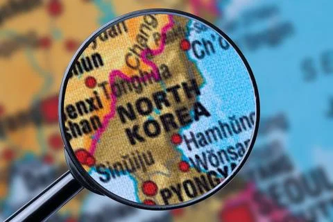 Map of NORTH KOREA through magnifying glass. Stock Photos