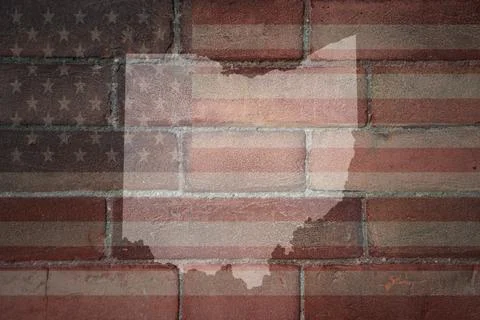 Map of ohio state on a painted flag of united states of america on a brick wa Stock Photos