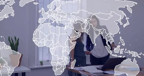 Map overlay growing, pair leaning over laptop, pointing and tapping papers, Fotos Stock