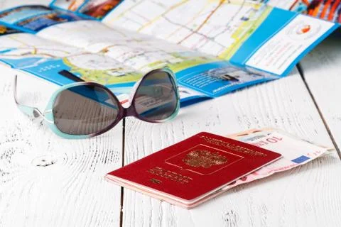 Map, passport, notebook and cup of coffee on wooden table, travel ideas Stock-Fotos