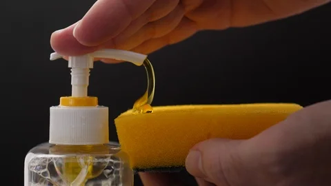 Map push bottle pump liquid dish soap squeeze out to sponge for manual washing Stock Footage 85508610
