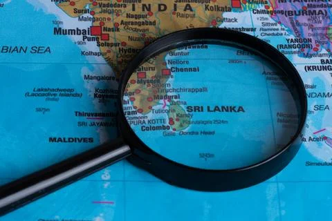 Map of Sri lanka through magnifying glass.Close-up. Stock Photos