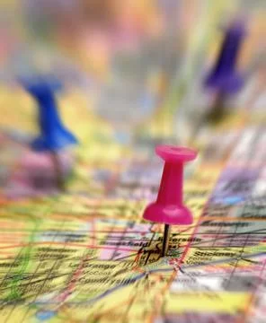 Map with Thumb Tacks Action Zoom to Destination Stock Photos