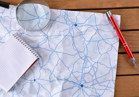 Map with tracks on a wooden table Stock Photos