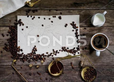 Map of the world, coffee beans on old paper. Eurasia, America, Australia, Africa Stock Photos