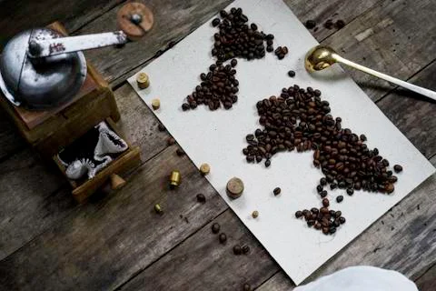Map of the world, coffee beans on old paper. Eurasia, America, Australia, Africa Stock Photos