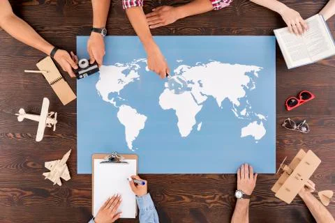 Map of the world laying on a table Stock-Fotos