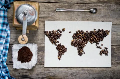 Map of the world, lined with coffee beans on old paper. Eurasia, America Stock Photos