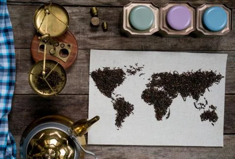 Map of the world, lined with tea leaves on old paper. vintage. green tea, a Stock Photos