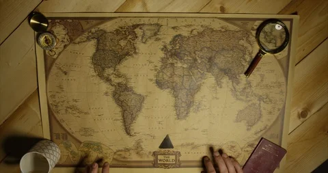 Map of World As Man Picks To Travel To Africa On Old Beautiful Traditional Map Stock Footage 114034636