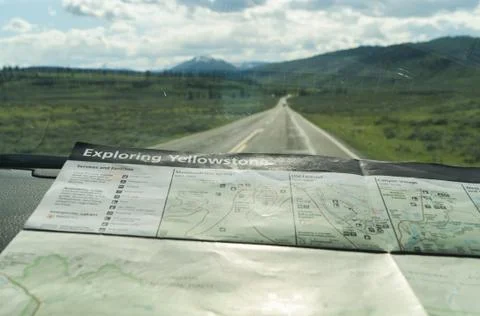 Map of yellowstone on front mirror of car on the road Stock Photos