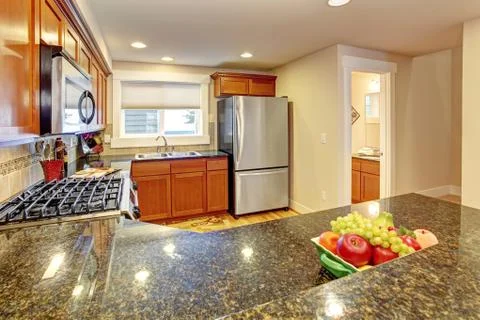 Maple kitchen cabinets with granite tops Stock Photos