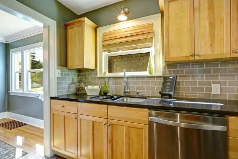 Maple kitchen cabinets with tile back splash trim Stock Photos