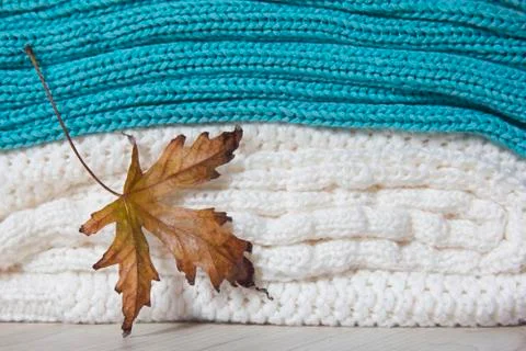 Maple leaf with knitted woolen sweaters Stockfoto's