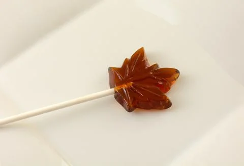 Maple leaf maple syrup lollipop Stock Photos