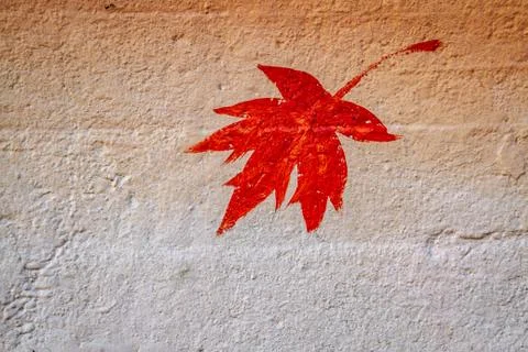 Maple leaf painted on concrete Photos