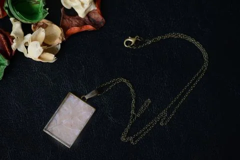 Maple leaf pendant on a dark background close up Stock Photos