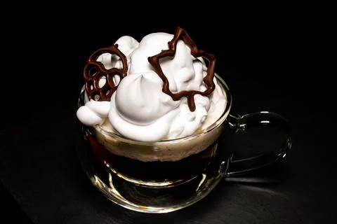 Maple leaf, printed with chocolate on a 3D printer, on a cup of coffee Stock Photos