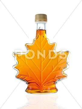 Maple Leaf Shaped Maple Syrup Bottle Isolated On A White Background Stock Photos