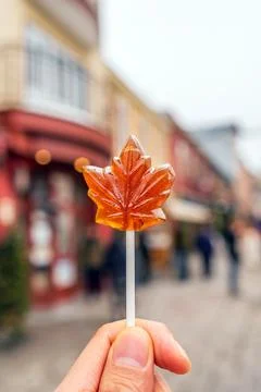 Maple syrup candy on stick in Quebec City Stock Photos