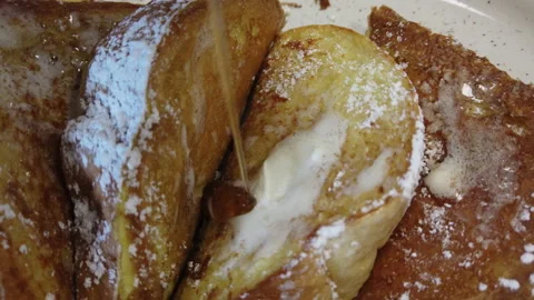 Maple syrup falling on French toast breakfast is ready to eat Video stock 157346928