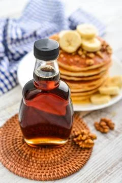 Maple syrup in glass bottle Stock Photos