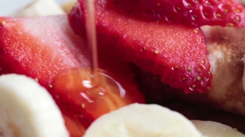 Maple syrup poured over fresh fruit Stock Footage 40613872