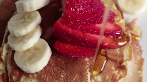 Maple syrup poured over fresh fruit Stock Footage 40855798