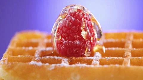 Maple Syrup pouring over delicious waffle with berries. Stock-Footage 336589393