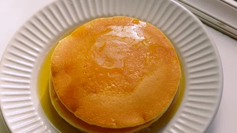 Maple Syrup Soaked Soft Buttermilk Pancakes with Golden Gooey Shine. Stock Footage 338425007