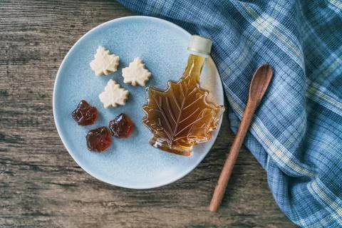Maple syrup top view of organic natural product from Canada. Maple leaf shape Stock Photos