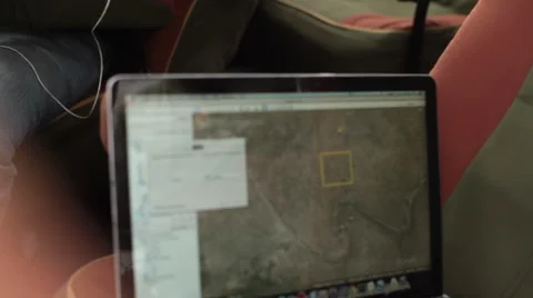 Mapping with google earth on computer, close up, shallow DOF Stock Footage 51954754