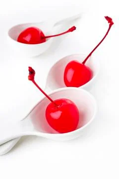 Maraschino cherry in spoon Stock Photos