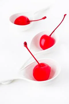 Maraschino in spoon Stock Photos