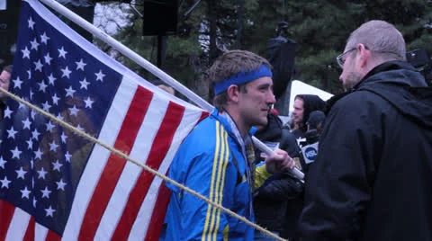 Marathon runner holding a Flag Stock Footage 22731547