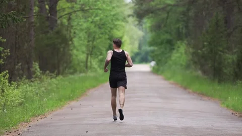 Marathon Runner Jog On Forest. Running Man In Forest. Sport Concept. Stock Footage 132056880