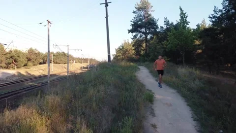 Marathon Runner Jog On Forest. Triathlete Running,Sprinting And Endurance Video stock 143710619