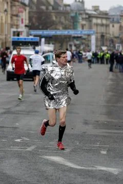 Marathon runner warming up.Bath, UK. Stock Photos