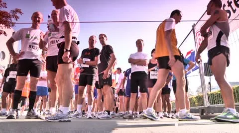 Marathon runners getting ready just before the start of a marathon Stock Footage 10600504