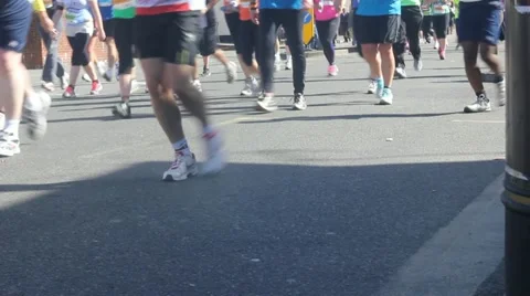 Marathon runners legs run by Stock Footage 10882368